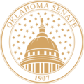 Historic Oklahoma state emblem featuring the Great Seal design