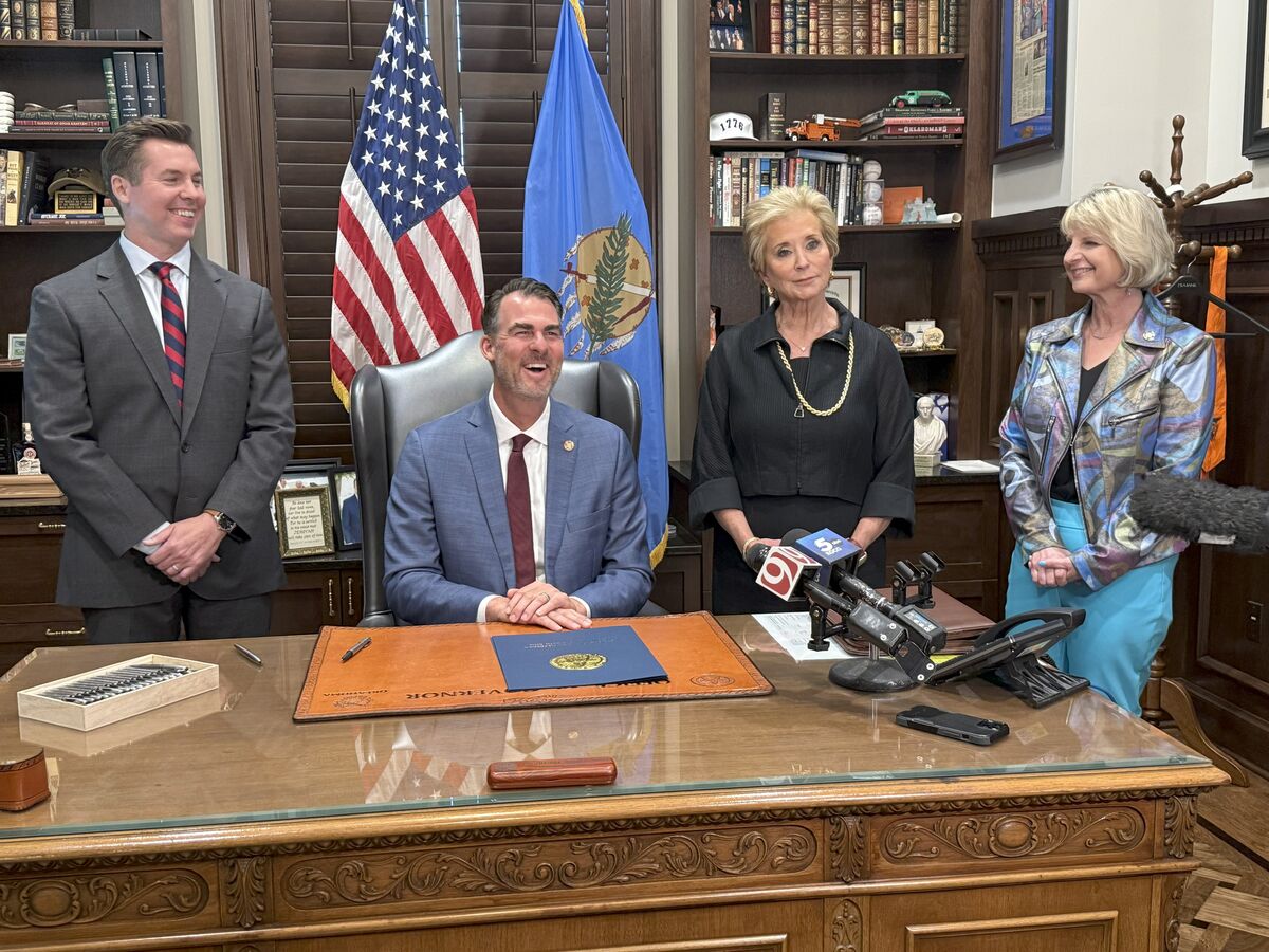 Senator Adam Pugh (Left), stands beside Governor Stitt, U.S. Secretary of Education Linda McMahon and Representative Denise Crosswhite Hader during the ceremonial bill signing for Senate Bill 796.