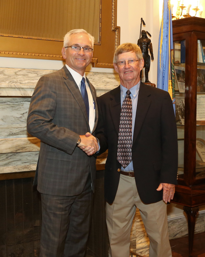 Sen. Darcy Jech, R- Kingfisher greets Southeastern Oklahoma State University baseball coach, Mike Metheny, at the State Capitol on Tuesday, May 9.