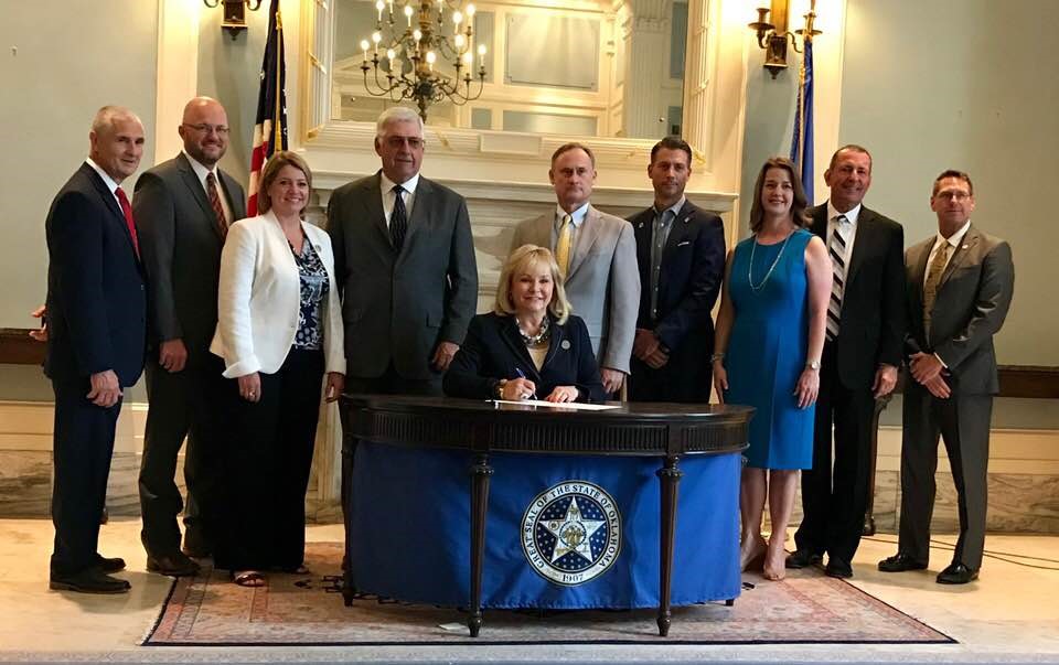 Several attended the ceremonial bill signing of SB 1294 at the state Capitol. Pictured from left to right are: Kent Wilkins with Oklahoma Water Resources Board (OWRB), Brent Kisling with Enid Regional Development Alliance (ERDA), Julie Cunningham with OWRB, Senator Roland Pederson, Governor Mary Fallin, Chris Gdanski with the City of Enid Engineering Dept., Michael Graves with Garver Engineering, Lisa Powell with Enid Regional Development Alliance, Duane Smith with Smith and Associates, and Owen Mills with OWRB.