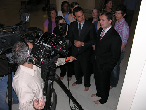 Senators Andrew Rice and Kenneth Corn talk to the media about the problems facing children in developing countries who don't have shoes. 